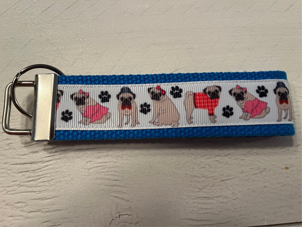 Pug Lover’s Wristlet Keychain – Dressed-Up Pug Design 🐾💙